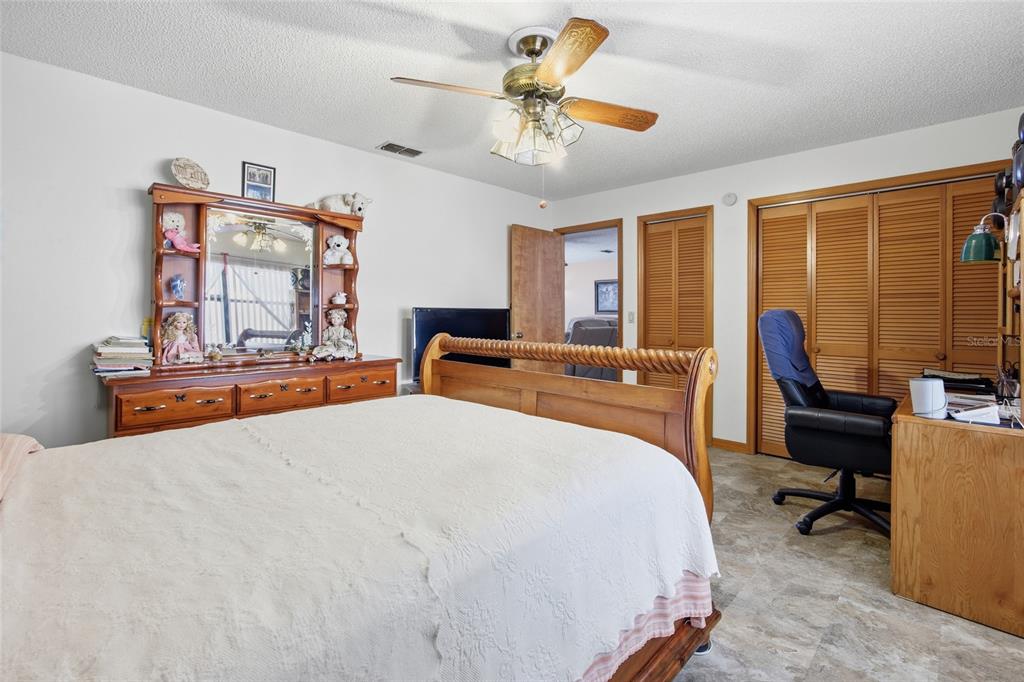 5141 East Backner Lane Inverness, FL 34452 - Photo 29 of 31 a bedroom with a bed and a desk