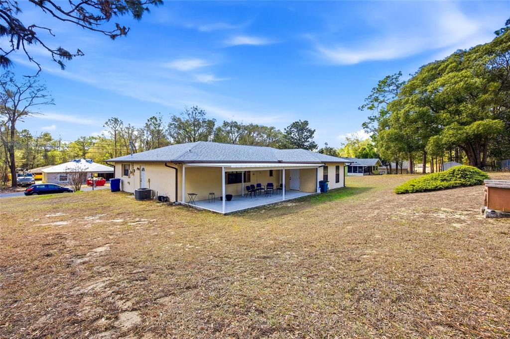 5141 East Backner Lane Inverness, FL 34452 - Photo 6 of 31 a front view of a house with garden