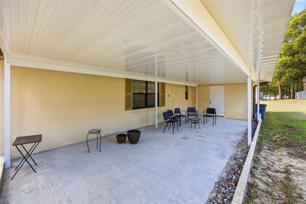 5141 East Backner Lane Inverness, FL 34452 - Photo 8 of 31 a view of a livingroom with chairs and table in patio
