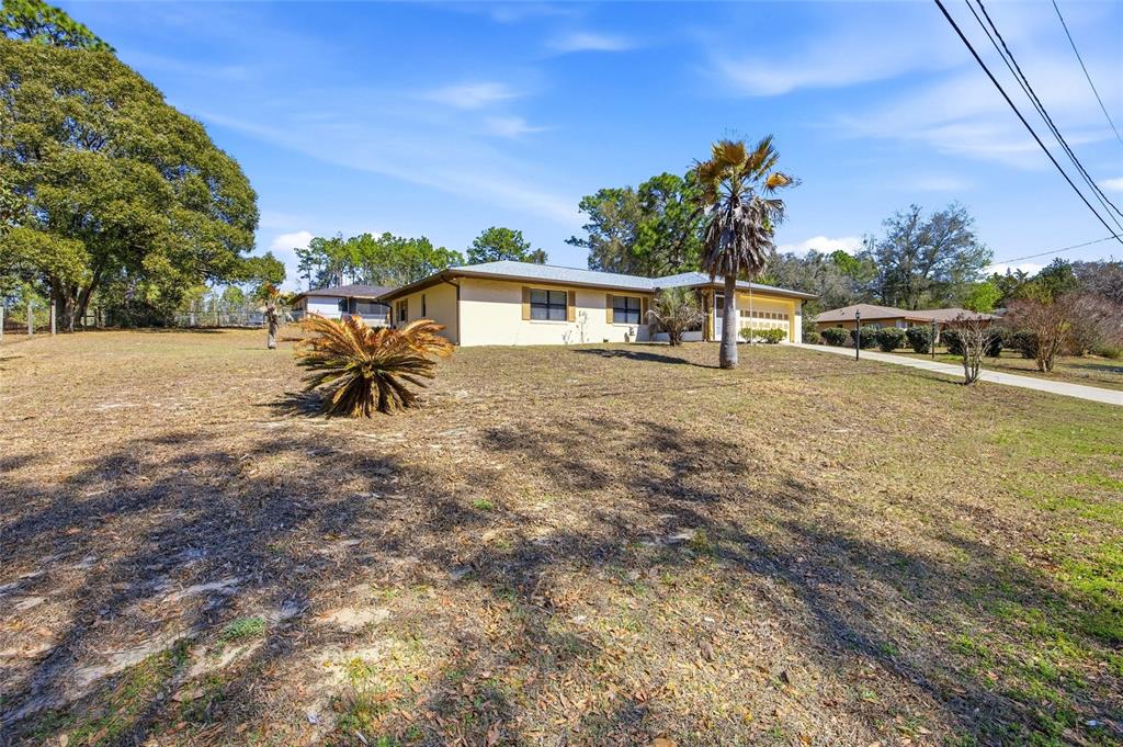 5141 East Backner Lane Inverness, FL 34452 - Photo 10 of 31 a view of a house with a yard and sitting area