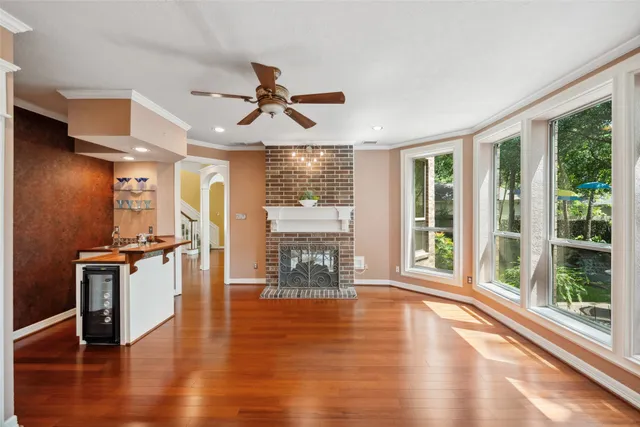 a open kitchen with stainless steel appliances granite countertop a stove and wooden floor