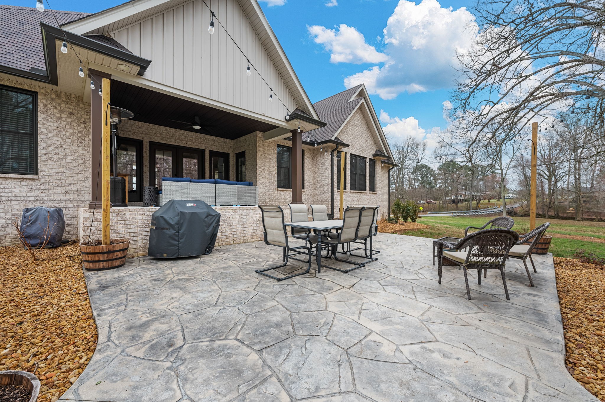 223 Duck River Road Manchester, TN 37355 - Photo 43 of 73 a view of a patio with table and chairs and floor to ceiling window