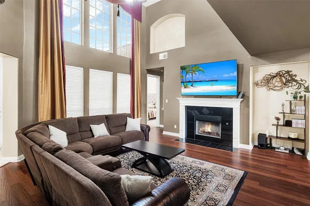 a living room with furniture and a fireplace