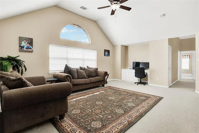 a living room with furniture and a rug