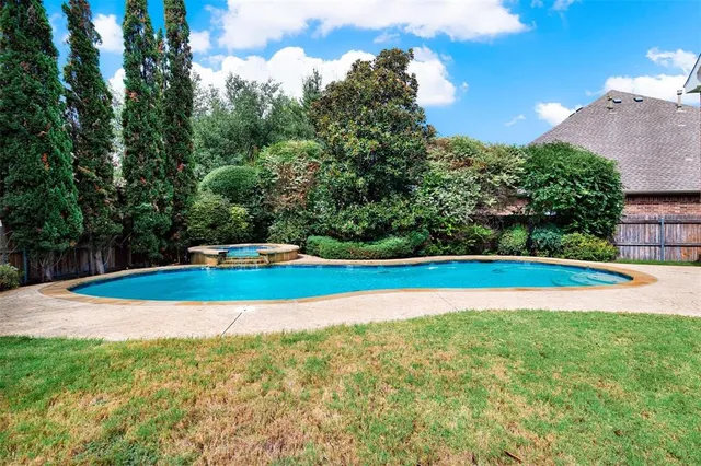 a view of a swimming pool with an outdoor space