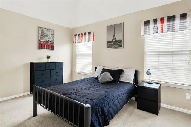 a bedroom with a bed and a dresser