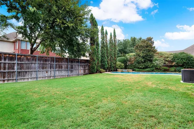 a view of a backyard with a garden