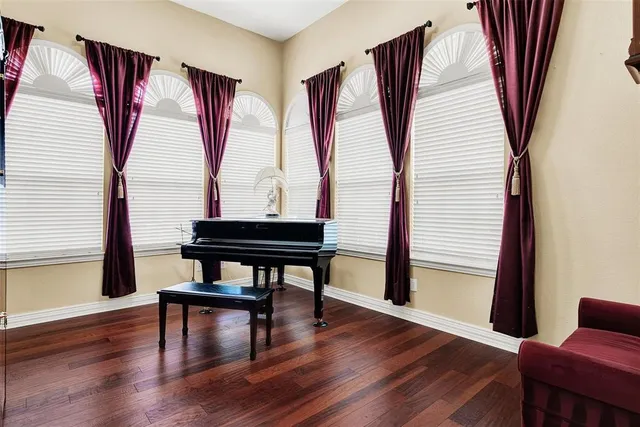 a reading room with furniture and a window