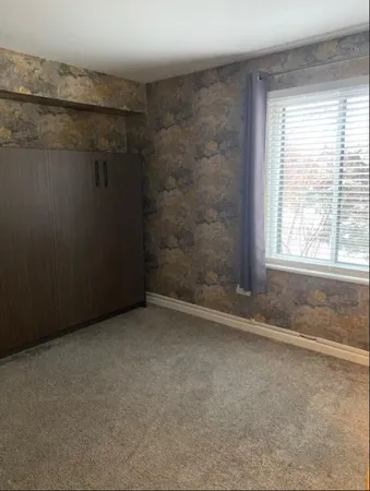 an empty room with a empty space and window