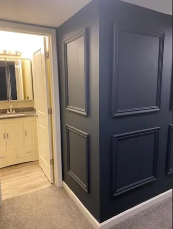 a view of a kitchen with refrigerator and window