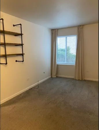 an empty room with a empty space and window