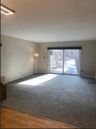 an empty room with a large window