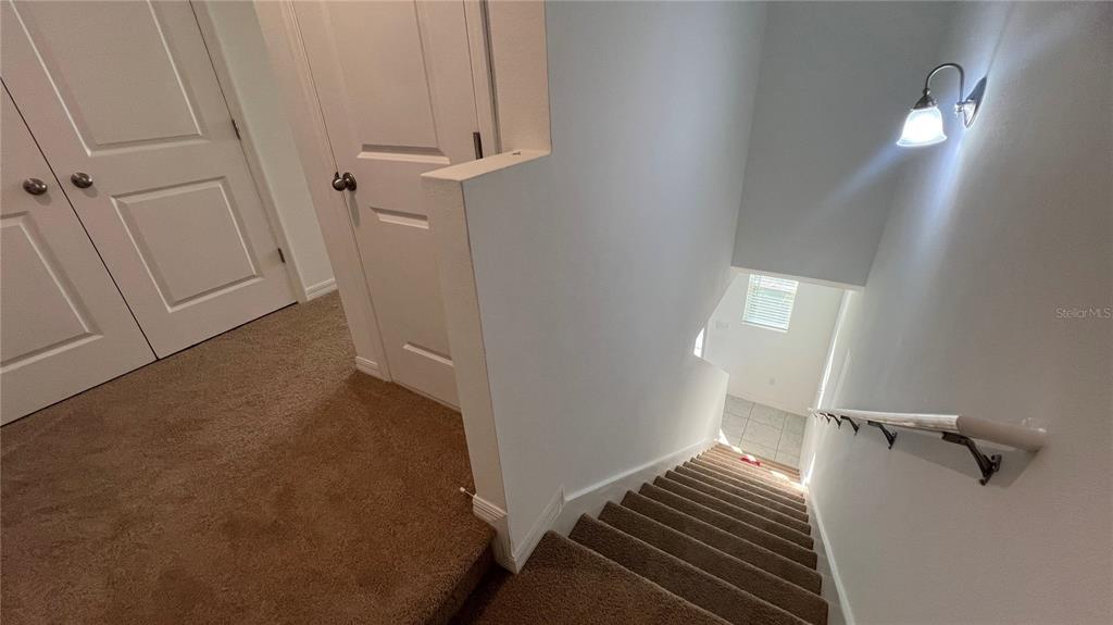 1064 Appleton Street Davenport, FL 33837 - Photo 12 of 28 a view of a room with wooden floor