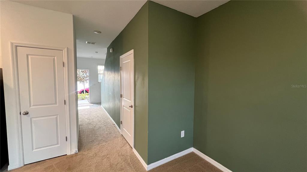 1064 Appleton Street Davenport, FL 33837 - Photo 9 of 28 a view of a hallway with wooden floor