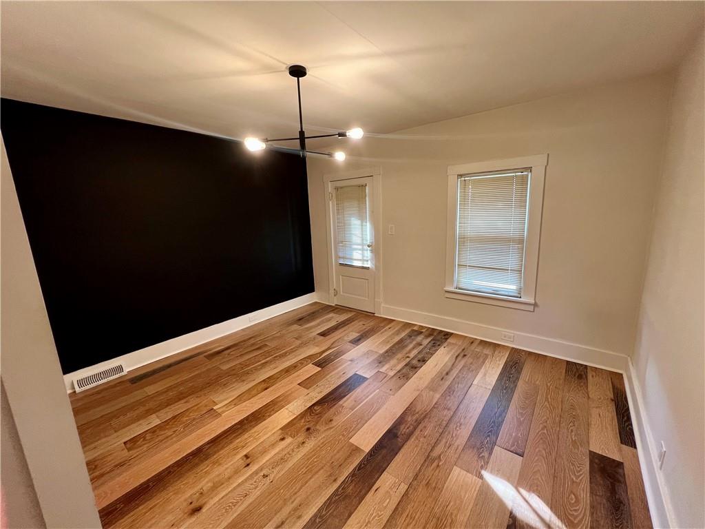 142 Alexander Avenue Strabane, PA 15363 - Photo 11 of 25 a view of empty room with wooden floor