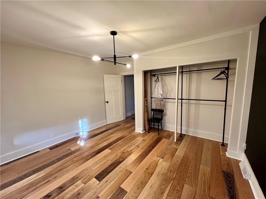 142 Alexander Avenue Strabane, PA 15363 - Photo 12 of 25 a view of empty room with wooden floor