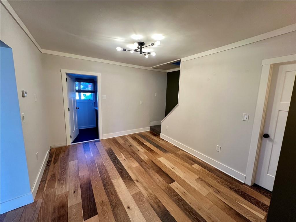 142 Alexander Avenue Strabane, PA 15363 - Photo 13 of 25 wooden floor in an empty room with a window