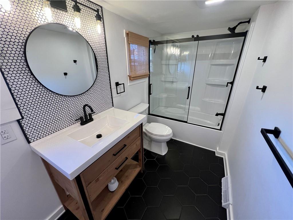 142 Alexander Avenue Strabane, PA 15363 - Photo 17 of 25 a bathroom with a toilet sink and mirror