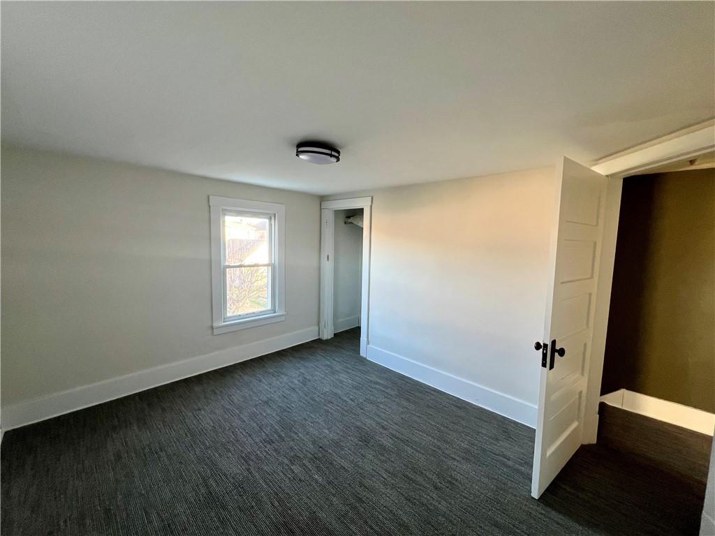 142 Alexander Avenue Strabane, PA 15363 - Photo 19 of 25 a view of an empty room with wooden floor and a window