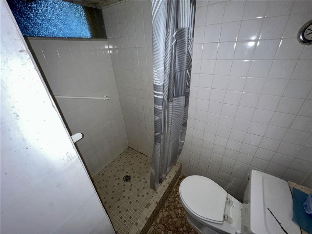 142 Alexander Avenue Strabane, PA 15363 - Photo 23 of 25 a bathroom with a toilet and a shower