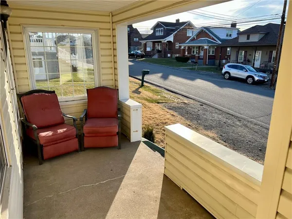 a view of a car park in front of house