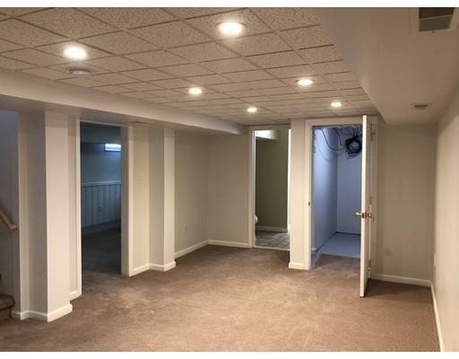 398 Maple Road Longmeadow, MA 01106 - Photo 11 of 18 a view of a hallway with wooden shelves