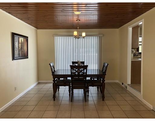 398 Maple Road Longmeadow, MA 01106 - Photo 6 of 18 a view of a dining room with furniture and chandelier
