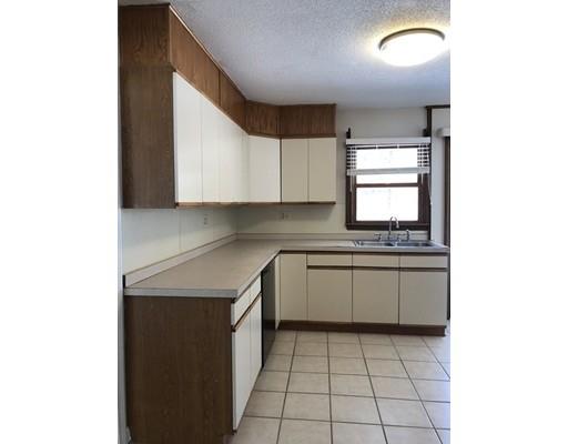 398 Maple Road Longmeadow, MA 01106 - Photo 8 of 18 a kitchen with a sink cabinets and a window