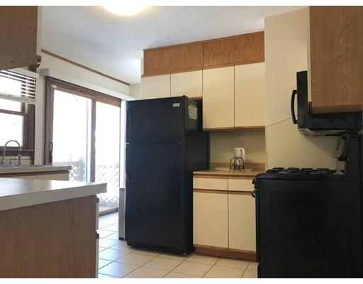 398 Maple Road Longmeadow, MA 01106 - Photo 9 of 18 a kitchen with a sink a refrigerator and a stove