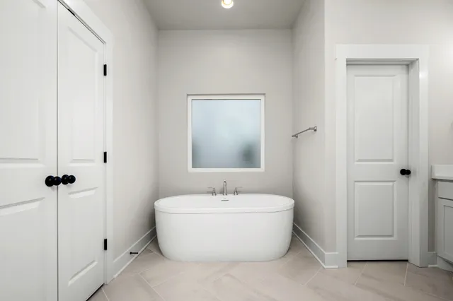 a bathroom with a bathtub and shower