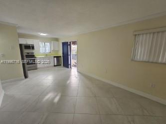 46 Northwest 35th Street, Unit 3 Miami, FL 33127 - Photo 3 of 5 a view of a kitchen with furniture and cabinets