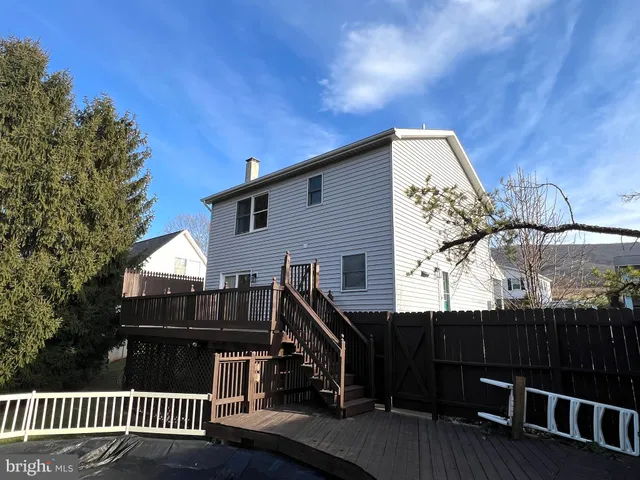 a view of a chairs and table in the patio