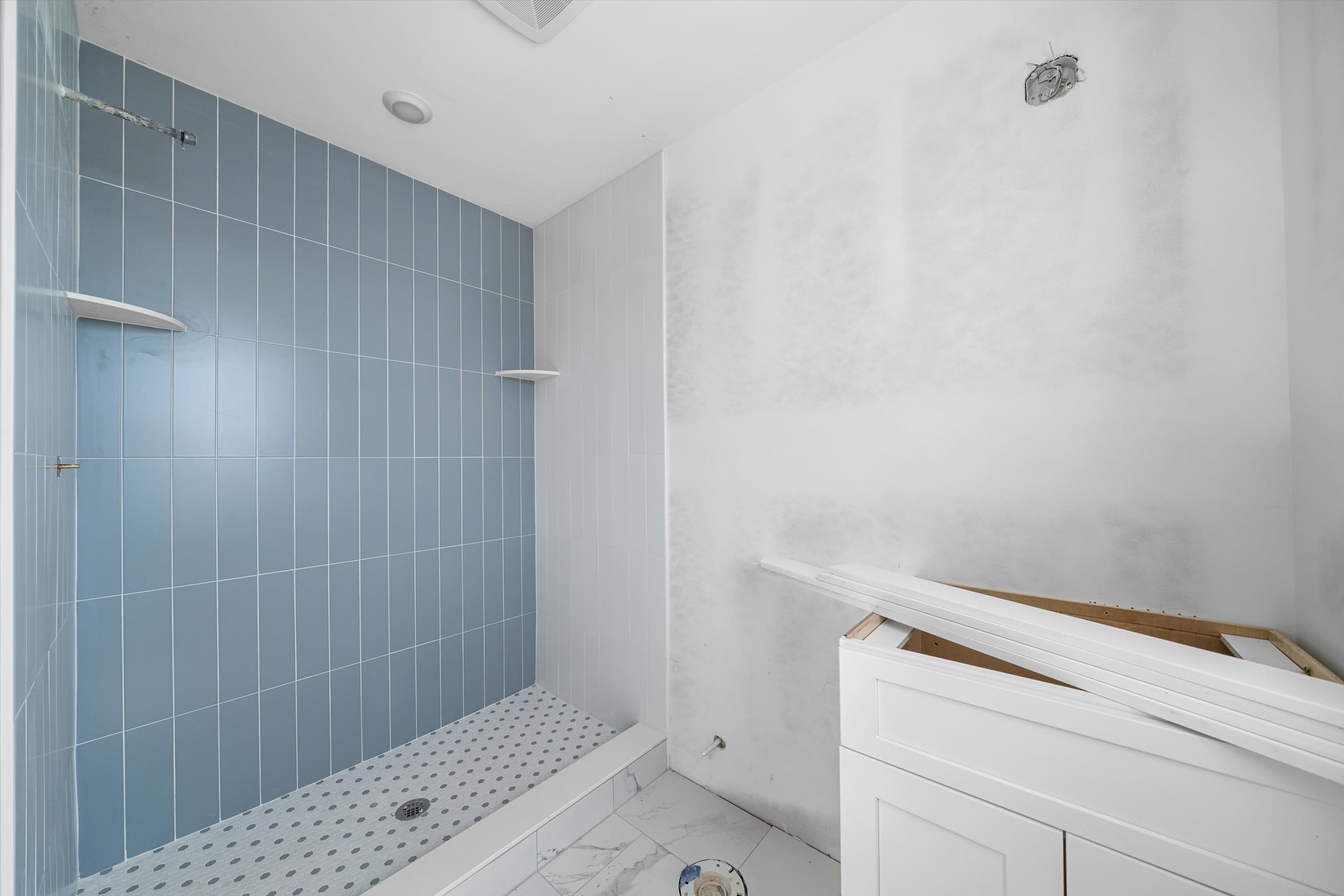 242 57th Street, Unit WEST Sea Isle City, NJ 08243 - Photo 11 of 20 a bathroom with a shower and toilet