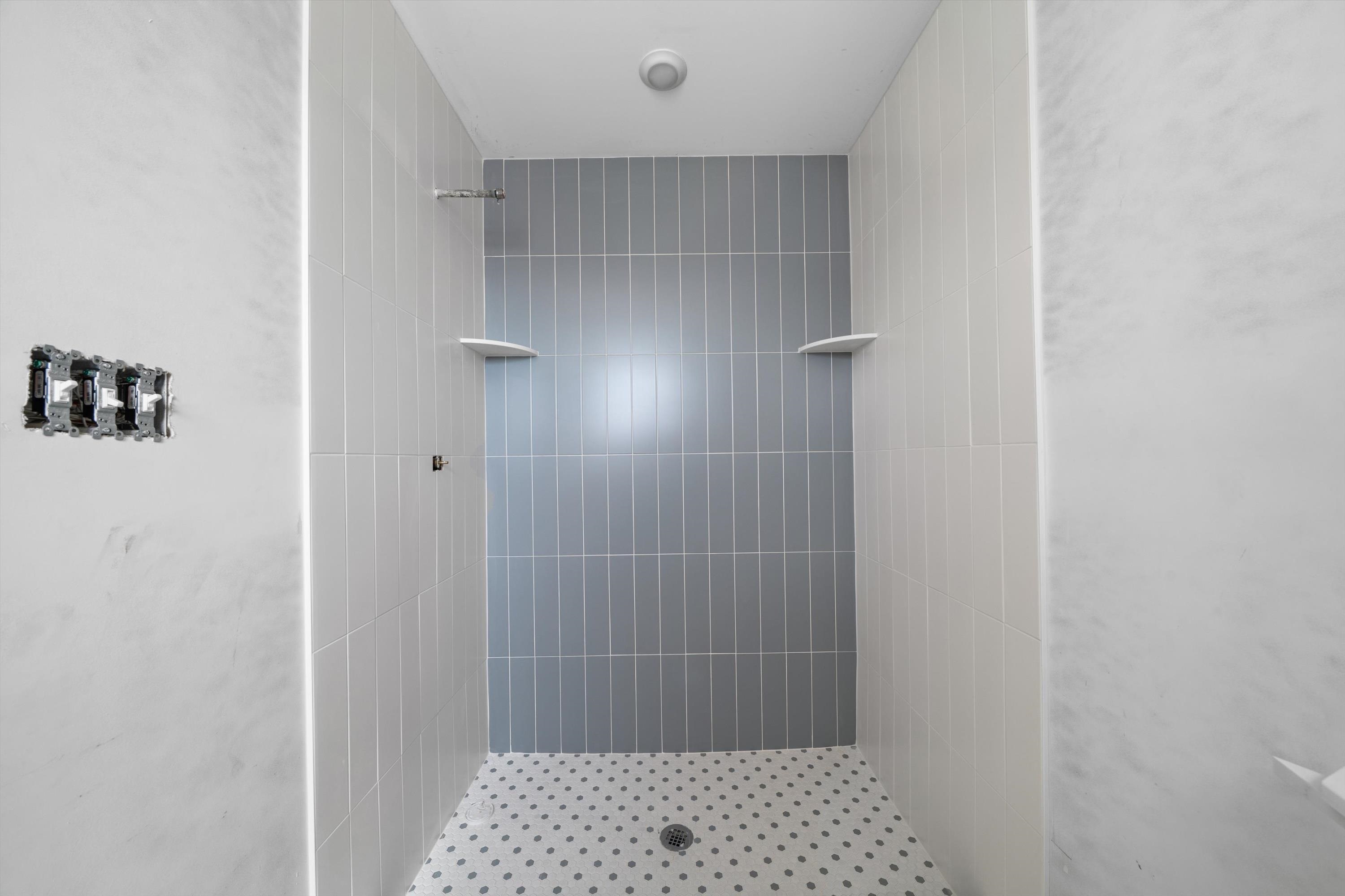 242 57th Street, Unit WEST Sea Isle City, NJ 08243 - Photo 13 of 20 a bathroom with a shower