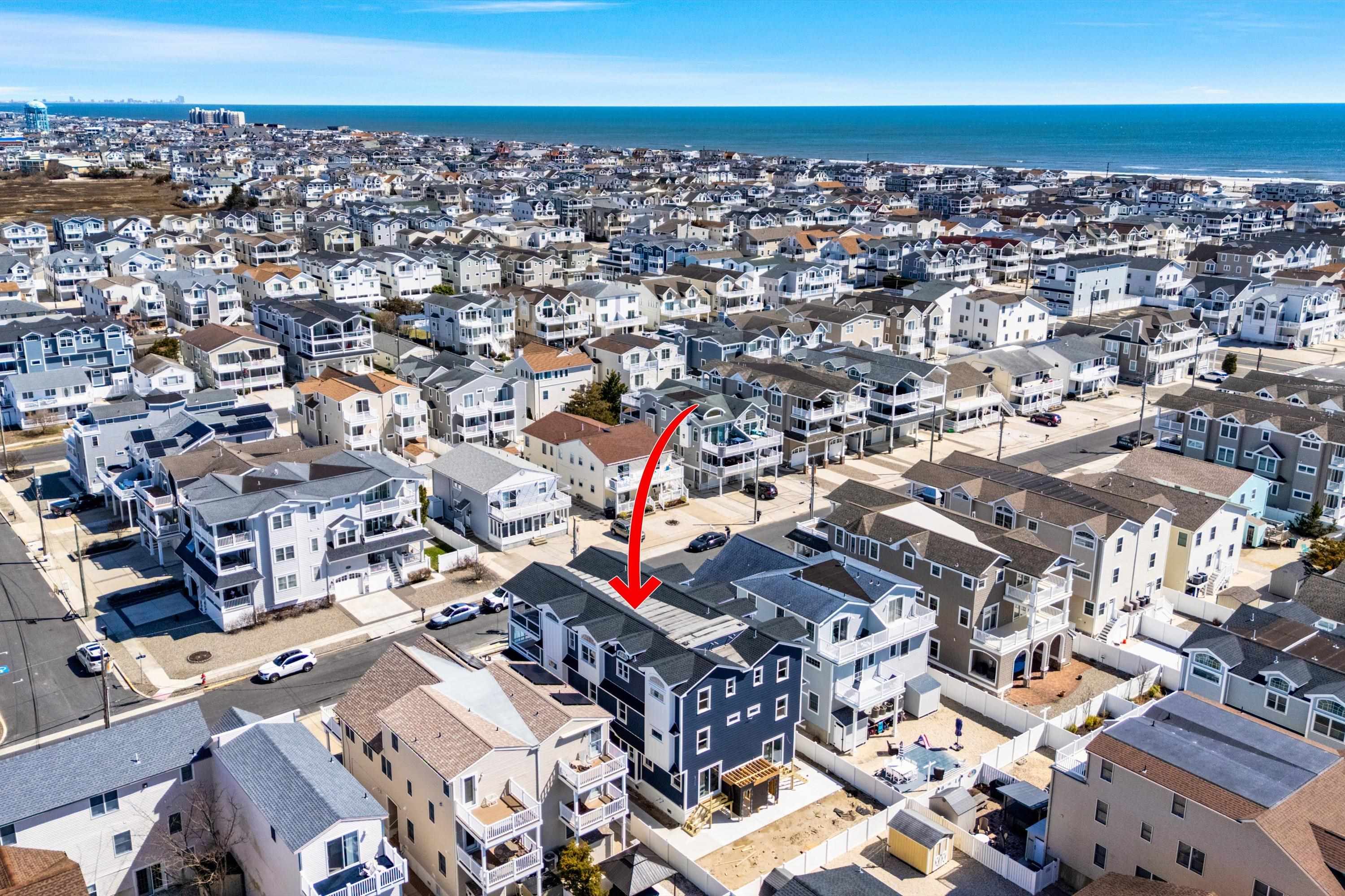 242 57th Street, Unit WEST Sea Isle City, NJ 08243 - Photo 3 of 20 an aerial view of a city