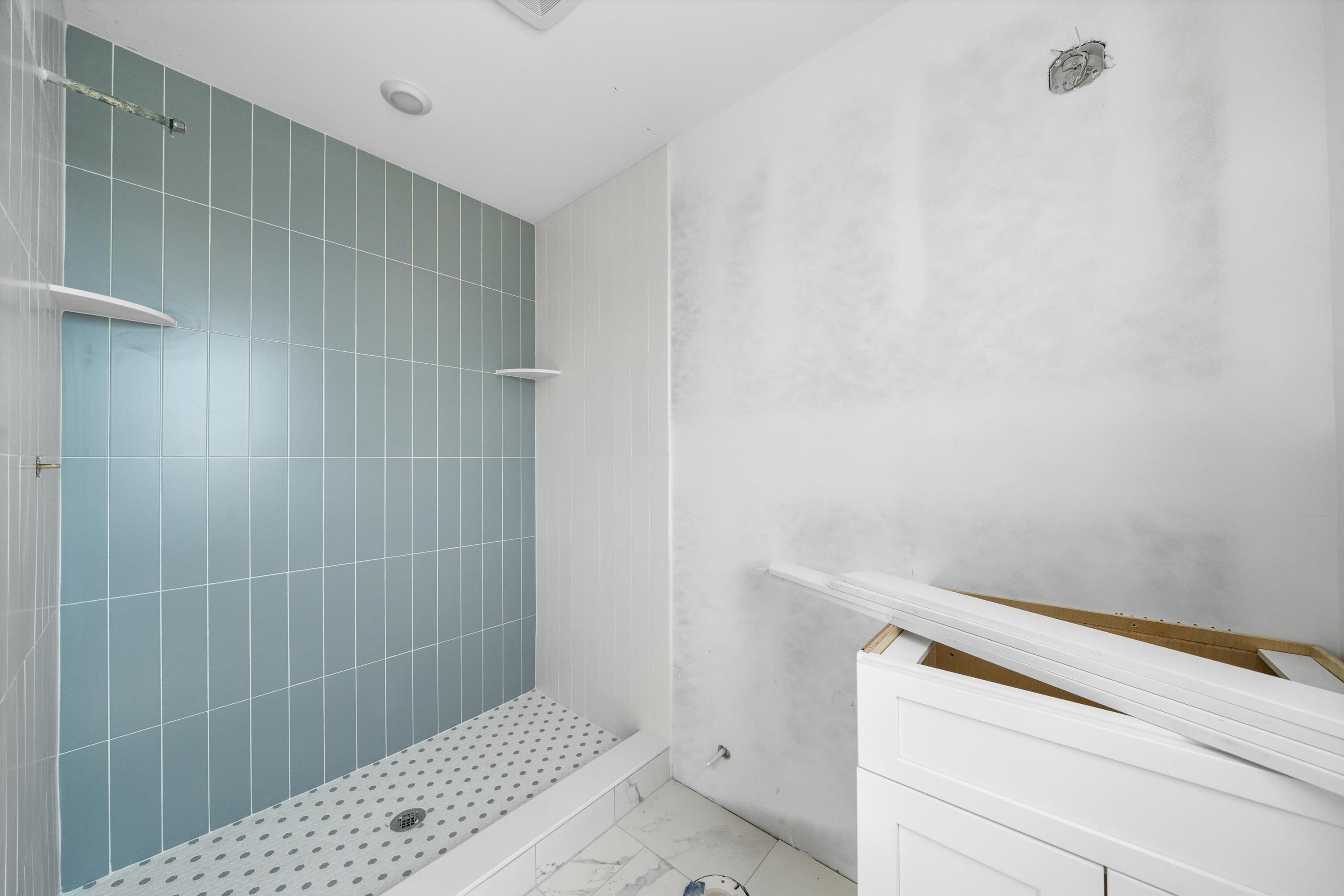242 57th Street, Unit WEST Sea Isle City, NJ 08243 - Photo 8 of 20 a bathroom with a shower and toilet