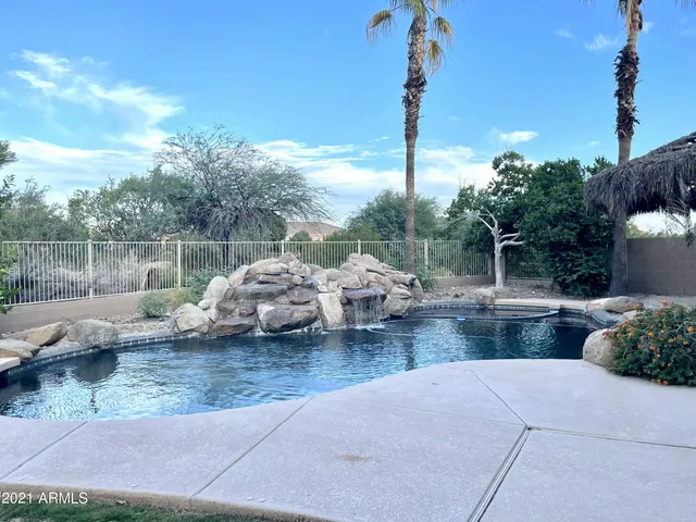 a view of a backyard with sitting area