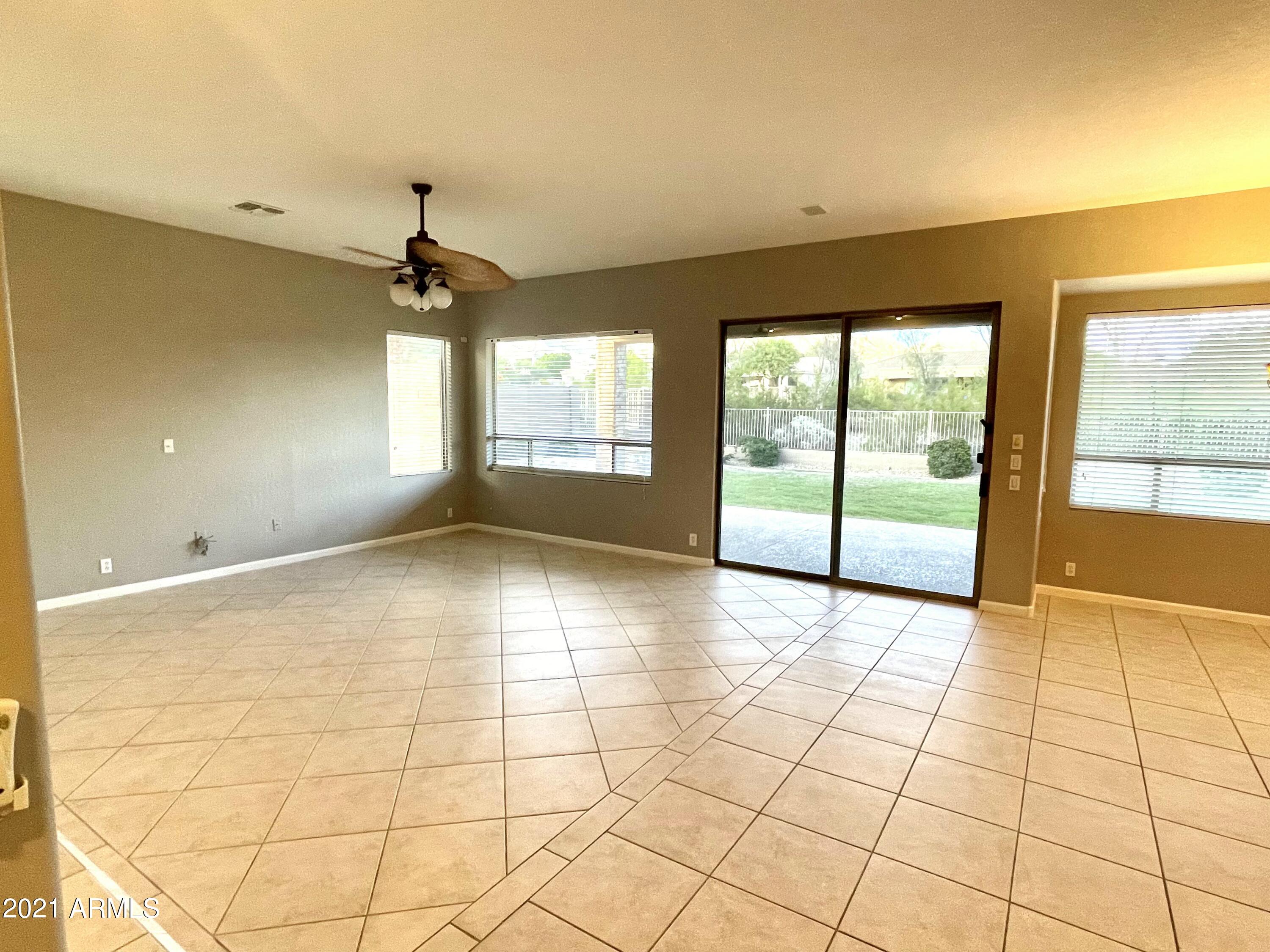 1608 West Amberwood Drive Phoenix, AZ 85045 - Photo 4 of 13 a view of an empty room with a window