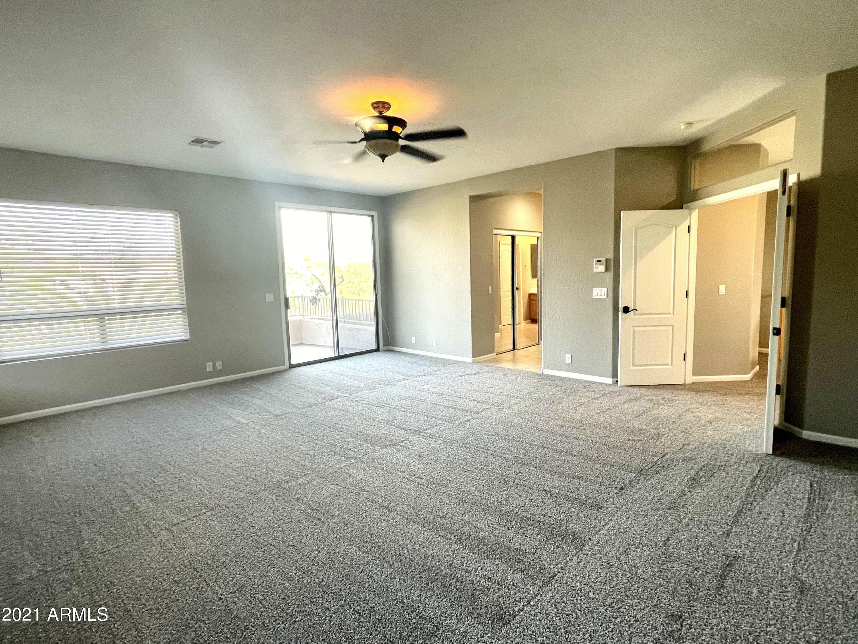 1608 West Amberwood Drive Phoenix, AZ 85045 - Photo 5 of 13 a view of an empty room with a window