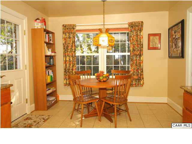 1430 Grove Road Charlottesville, VA 22901 - Photo 13 of 27 Breakfast nook for informal dining has a picture window with a nice view into the back yard.