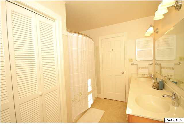 1430 Grove Road Charlottesville, VA 22901 - Photo 17 of 27 large linen closet and shower with tub.