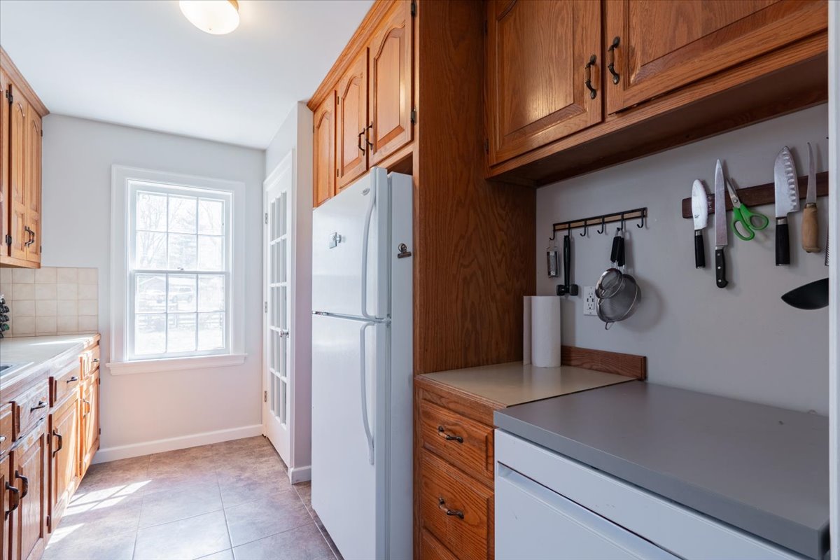413 Grant Street Normal, IL 61761 - Photo 12 of 40 a kitchen with a refrigerator and window