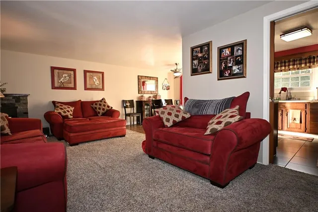 a living room with furniture and a piano