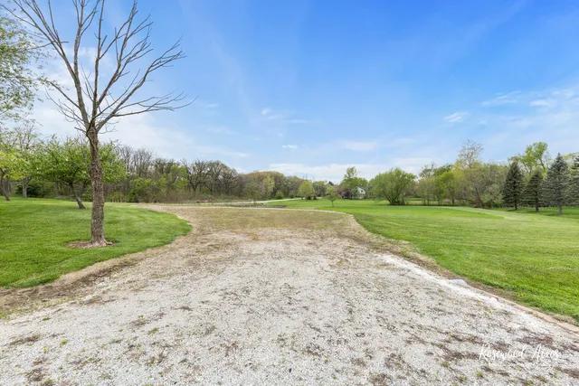 a view of a lake with a big yard