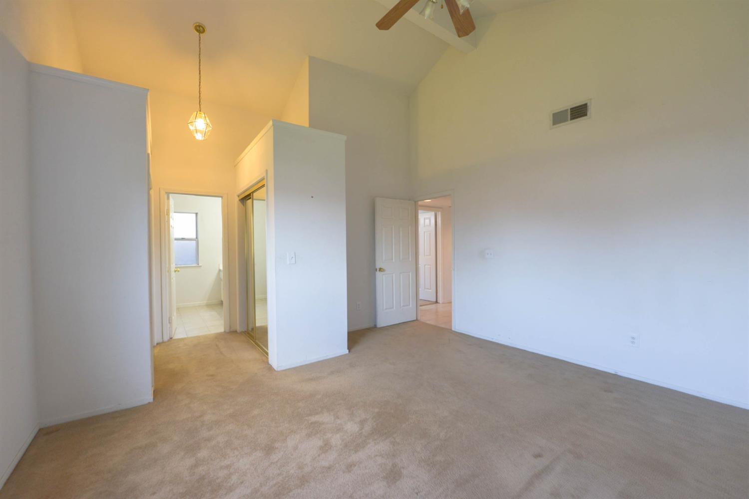 5572 West Sample Avenue Fresno, CA 93722 - Photo 4 of 42 a view of a bathroom with a shower