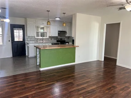 a view of kitchen with wooden floor