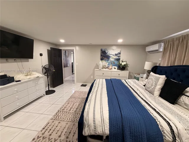 a bathroom with a sink mirror and toilet
