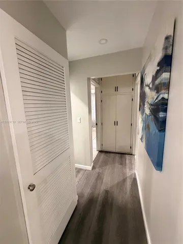 a bathroom with a sink a toilet a mirror and shower