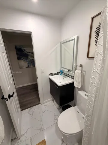 a bedroom with double bed and a window