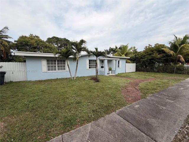 a house view with a garden space